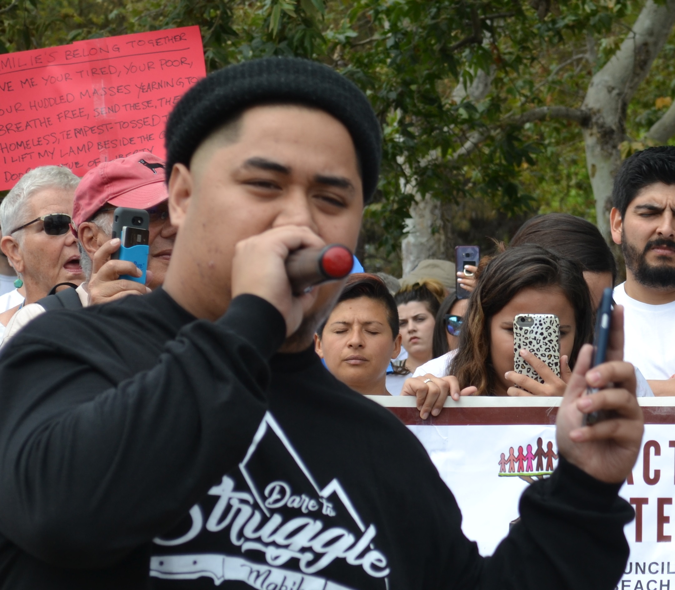 Jedi Jimenez speaks, Saturday, June 30, to pro-immigration protesters in Caesar Chavez Park, Long Beach; photo by Barry Saks