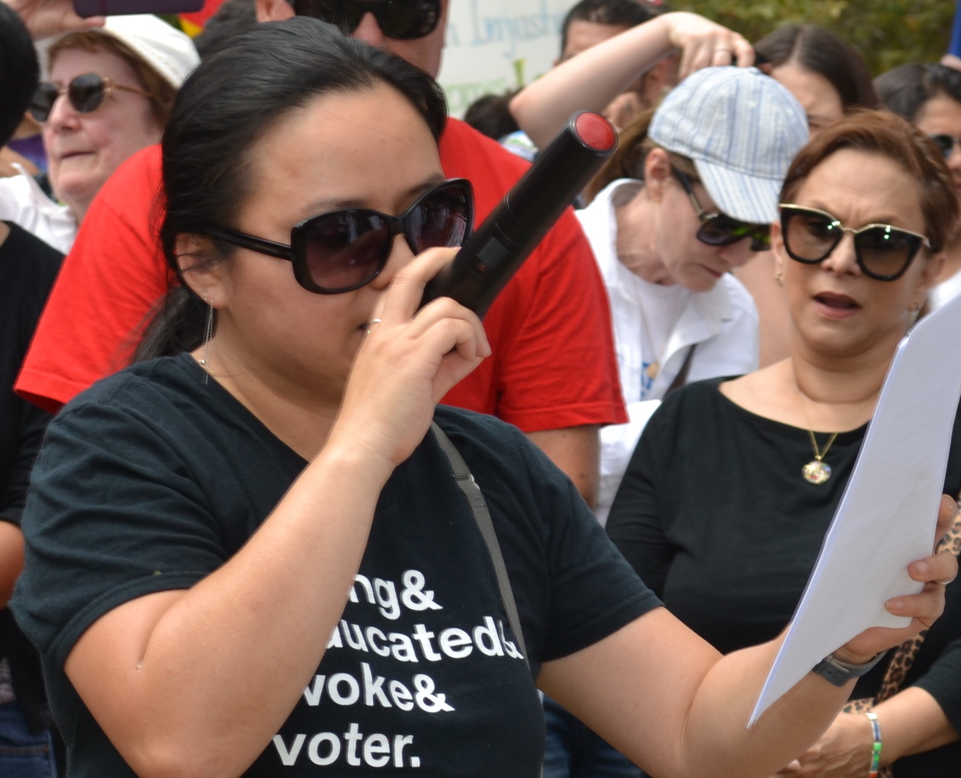 Lian Cheun speaks on Saturday, June 30, to pro-immgration protesters in Caesar Chavez Park, Long Beach; photo by Barry Saks